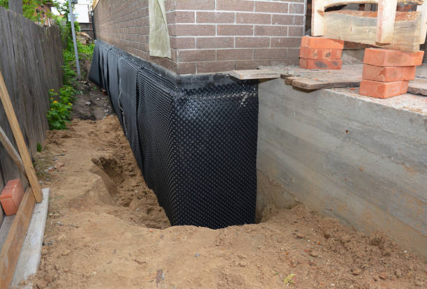Happy homeowners after waterproofing job in Niota